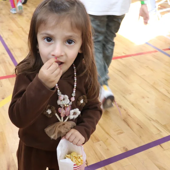 A nursery pupil in the school hall